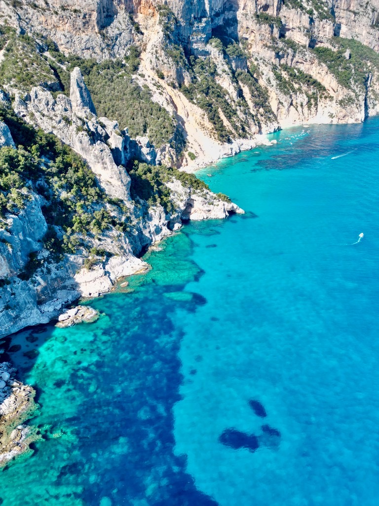 Aerial view of Cala Goloritzé coastline, Sardinia, with turquoise water and rocky cliffs