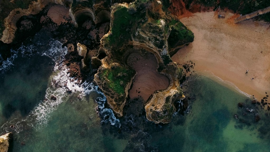 Aerial view of Praia de Marinha rock formations and sea caves, Algarve, Portugal
