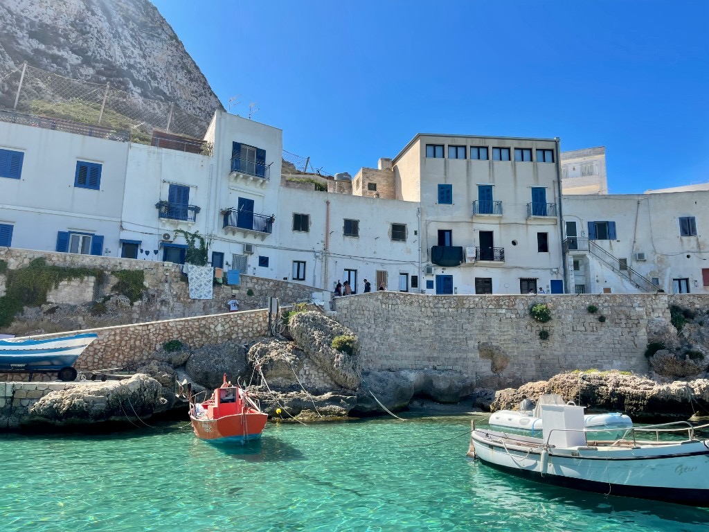 Colourful fishing boats in the port of Favignana island, Sicily, Italy